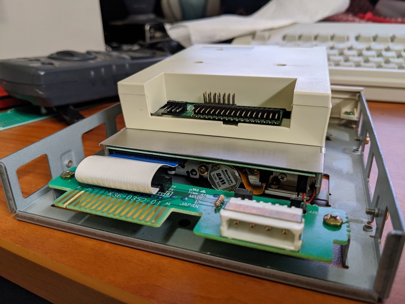 Picture of the original floppy drive ribbon cable and
                    adapter board.