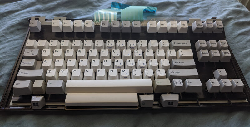 My Unicomp Mini M, with shell removed, showing the keys I replaced.