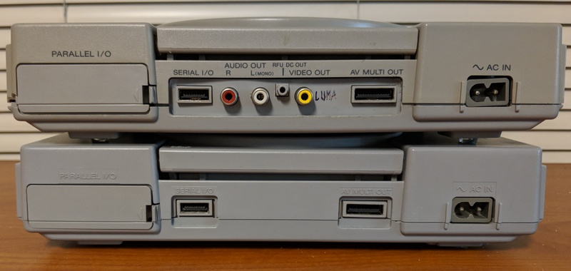Picture of two different-revision PlayStation units.