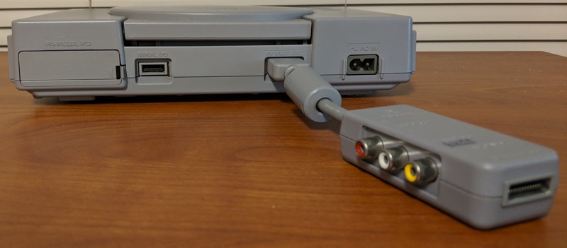Another picture of SCPH-1160, showing the connector for an additional A/V cable at the far end.